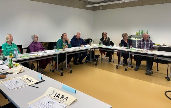 Group of older learners watching a presentation.